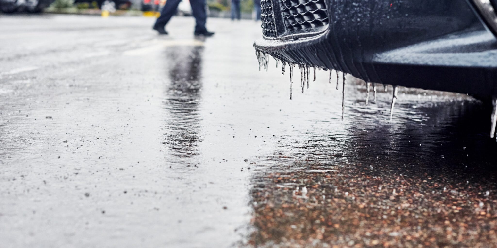 A slippery parking lot outside a convenience store