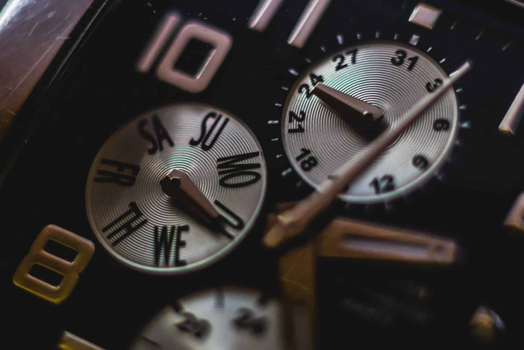 Understanding Time Limits in Filing a Lansing Personal Injury Case Close-up of a watch face featuring Roman numerals, weekday sub-dials, and 24-hour indicators with metallic hands pointing to various times—a reminder of the ticking clock in Lansing, MI, where the file time limit for a personal injury lawsuit should never be overlooked.